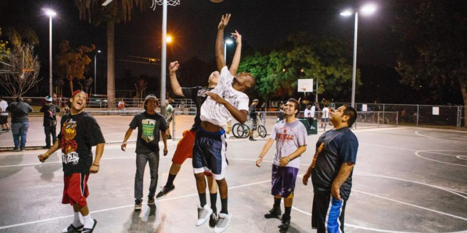 Jumping for rebound on basketball court